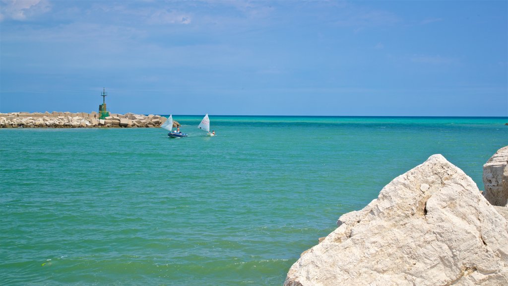 Giulianova Harbor showing general coastal views and parasailing