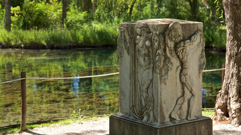 Springs of Clitunno which includes outdoor art and a pond