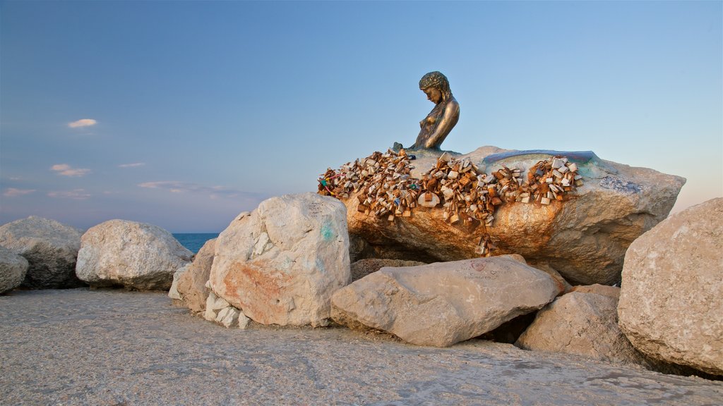 Senigallia showing outdoor art, a statue or sculpture and a sunset