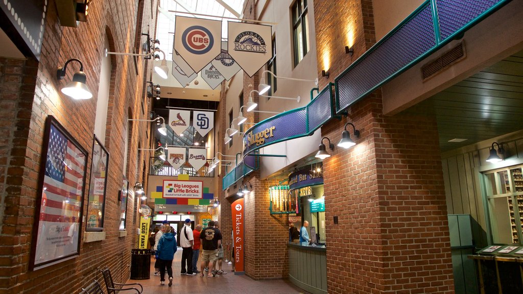 Louisville Slugger Museum featuring interior views as well as a small group of people