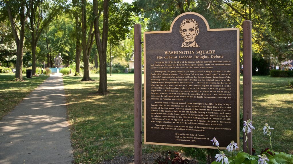 Washington Square Park which includes signage and a garden