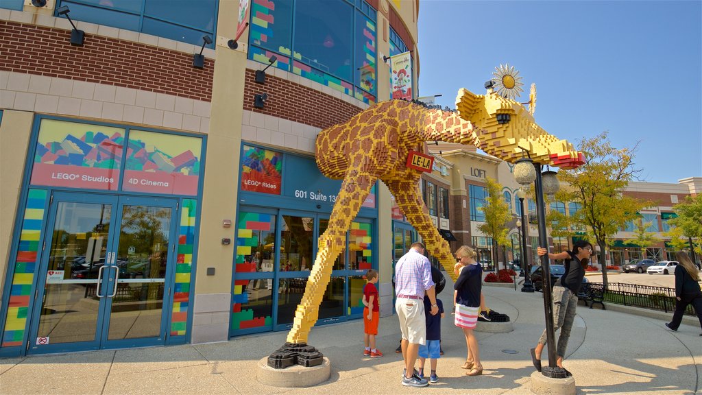 Legoland Discovery Center featuring outdoor art as well as a family