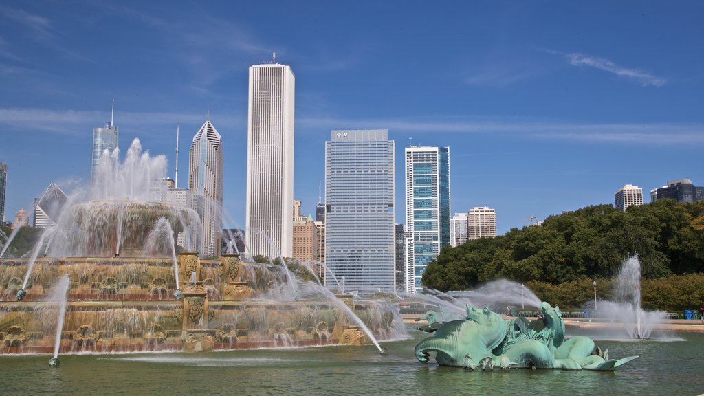 Buckingham Fountain which includes a skyscraper, a fountain and a city