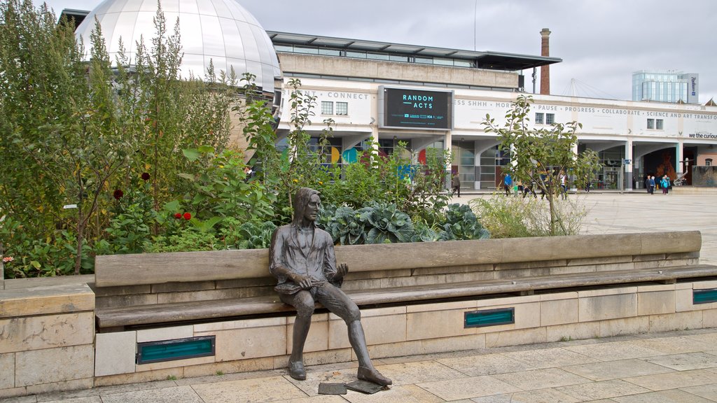 Millennium Square showing a statue or sculpture and outdoor art