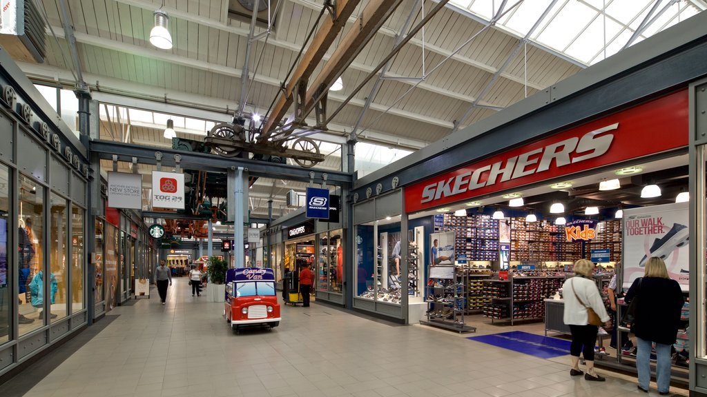 Swindon Designer Outlet featuring shopping, interior views and signage