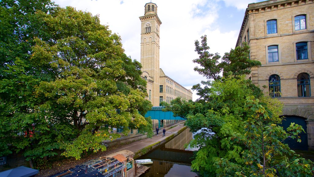 Salts Mill which includes heritage architecture and a river or creek