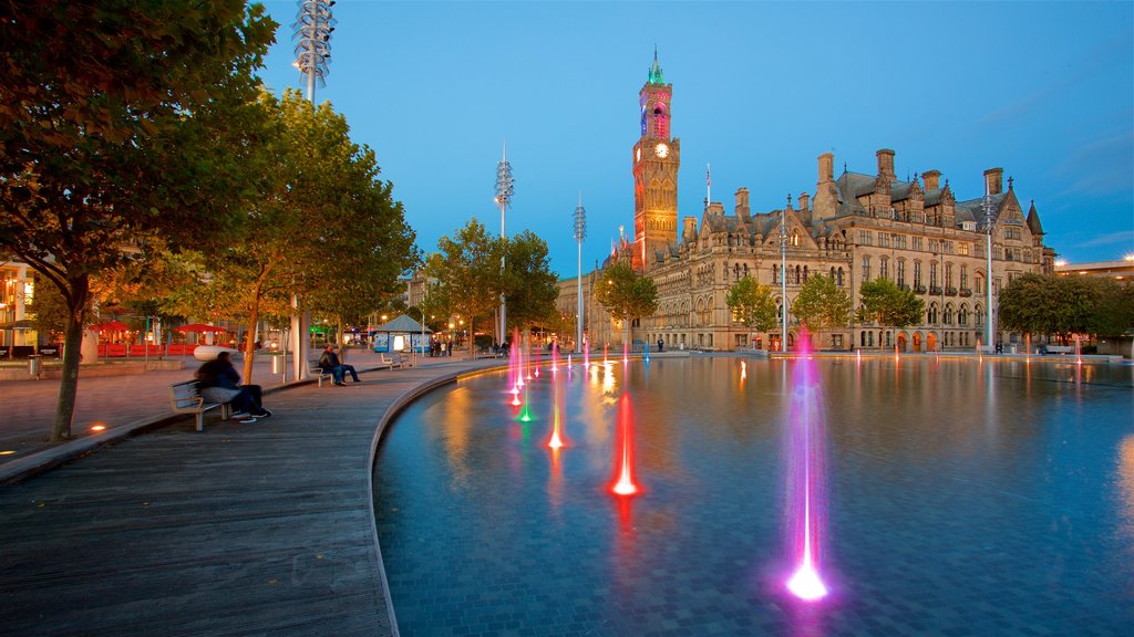 Bradford City Hall showing a pond, night scenes and a fountain