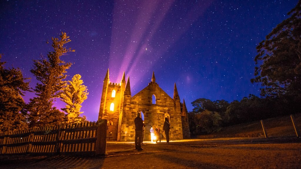 Hobart featuring night scenes and heritage architecture as well as a family