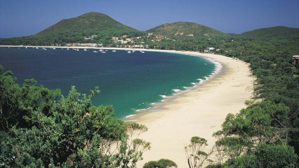 Port Stephens featuring a coastal town, landscape views and a sandy beach