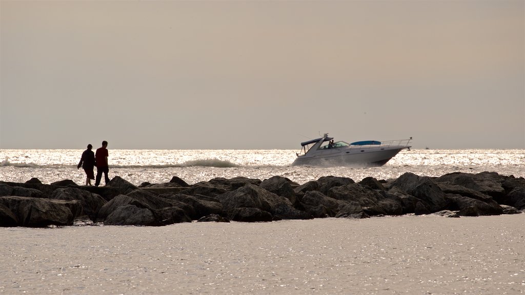 Pere Marquette Park Beach showing boating, general coastal views and a sunset