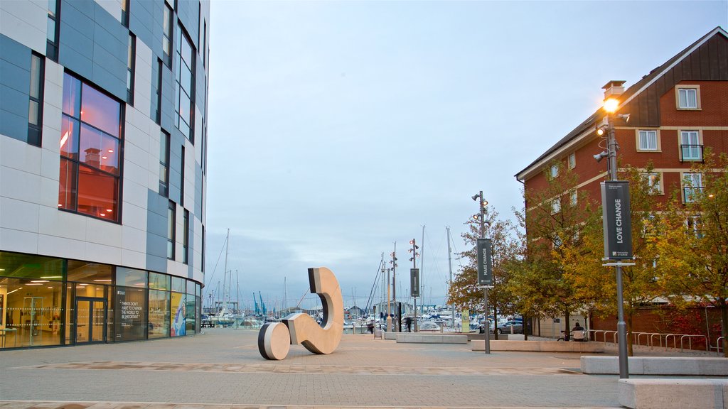 The Question Mark Sculpture which includes a bay or harbour and outdoor art