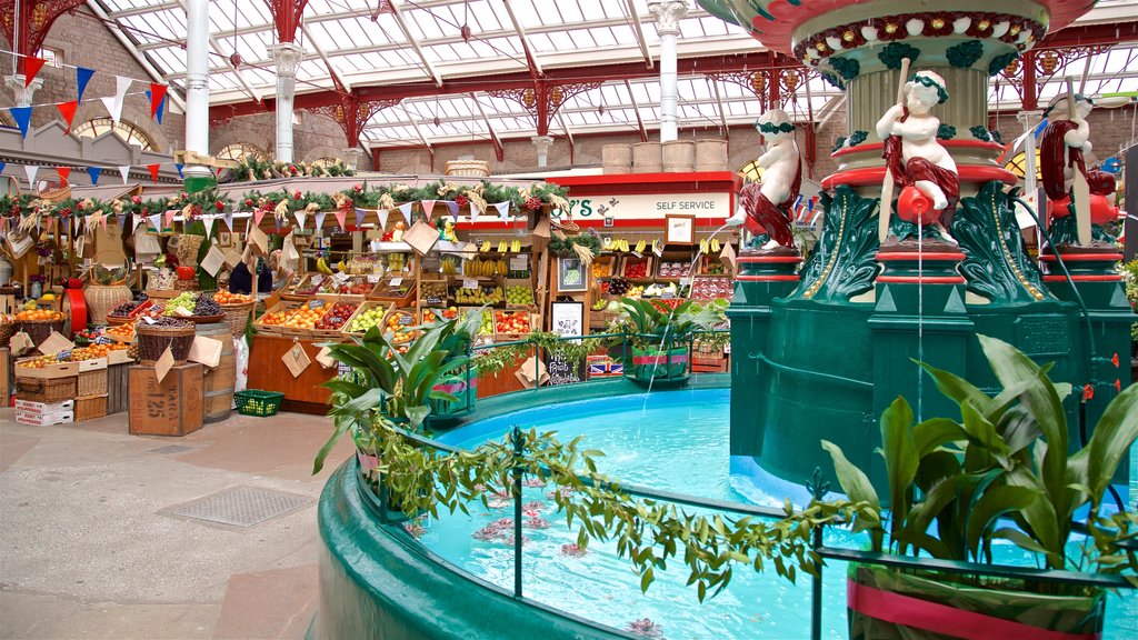 St. Helier Central Market featuring a fountain and markets