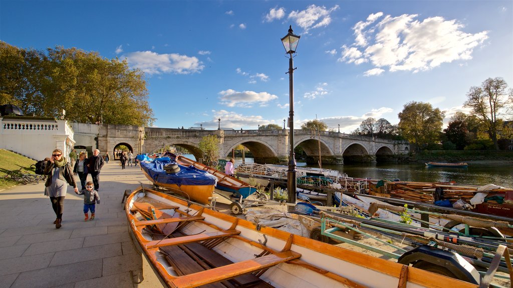 Richmond Bridge which includes a river or creek and a bridge as well as a family