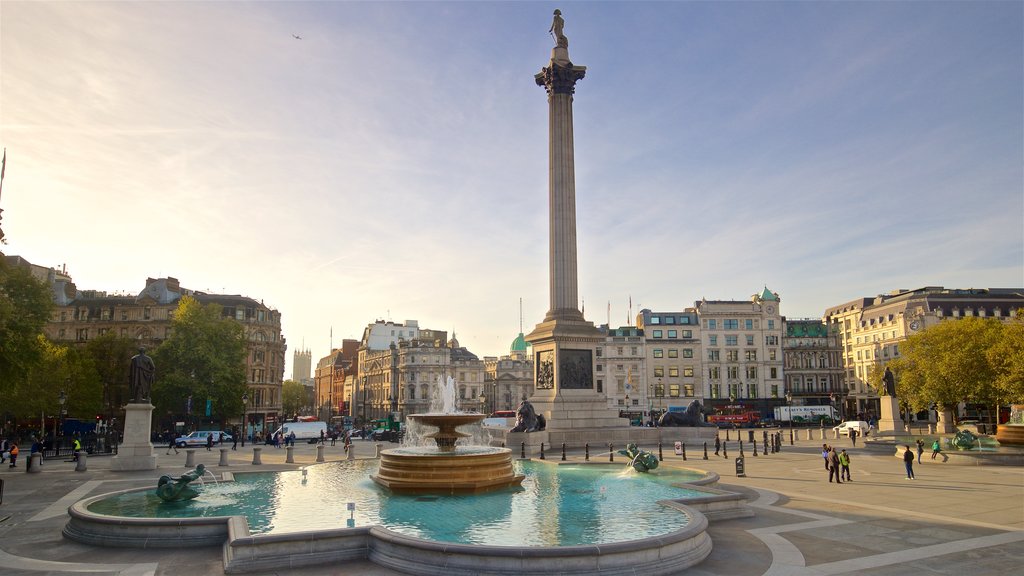 Trafalgar Square mostrando um pôr do sol, uma praça ou plaza e uma fonte