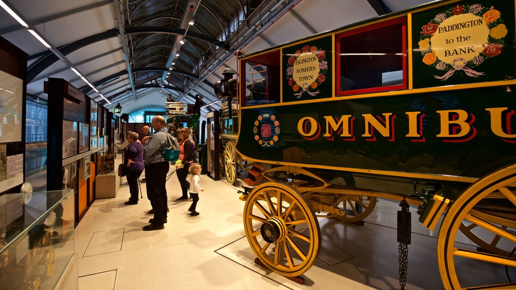 London Transport Museum showing interior views and heritage elements as well as a small group of people