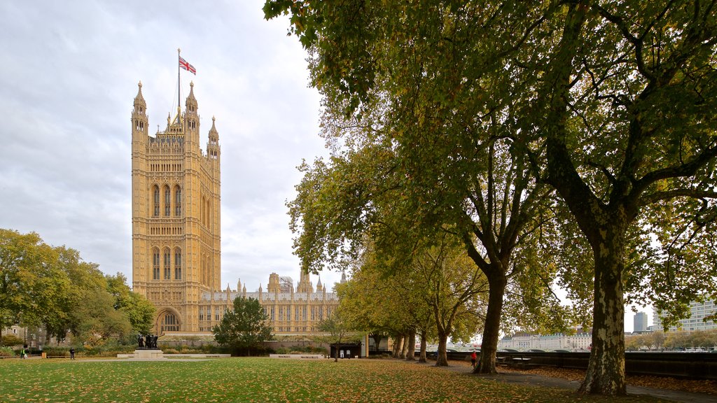 Victoria Tower showing a garden, heritage architecture and autumn leaves