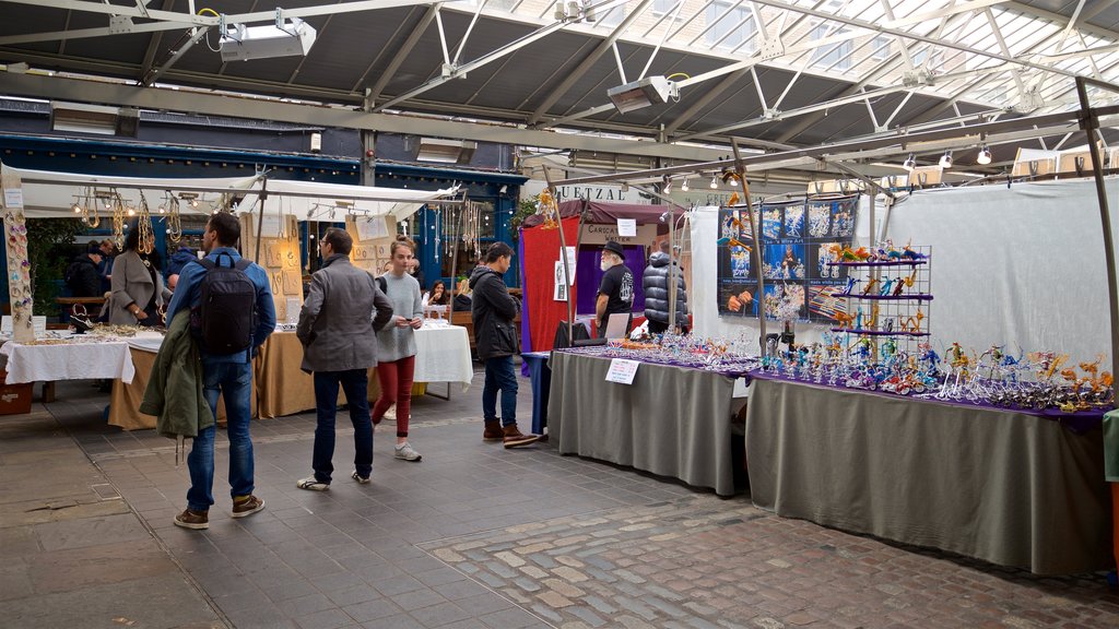 Greenwich Market featuring markets as well as a small group of people