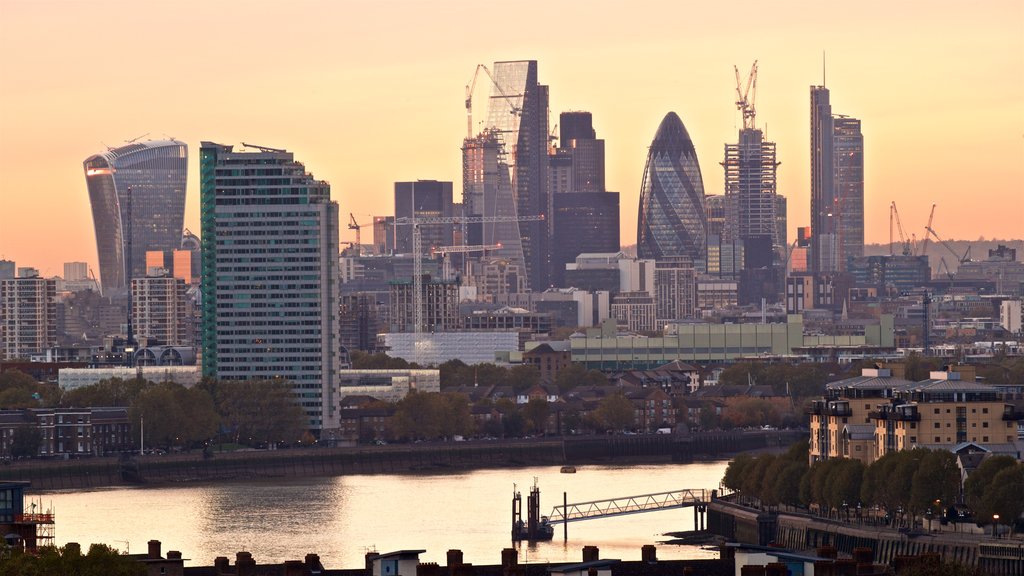 Greenwich Park showing a river or creek, modern architecture and a sunset