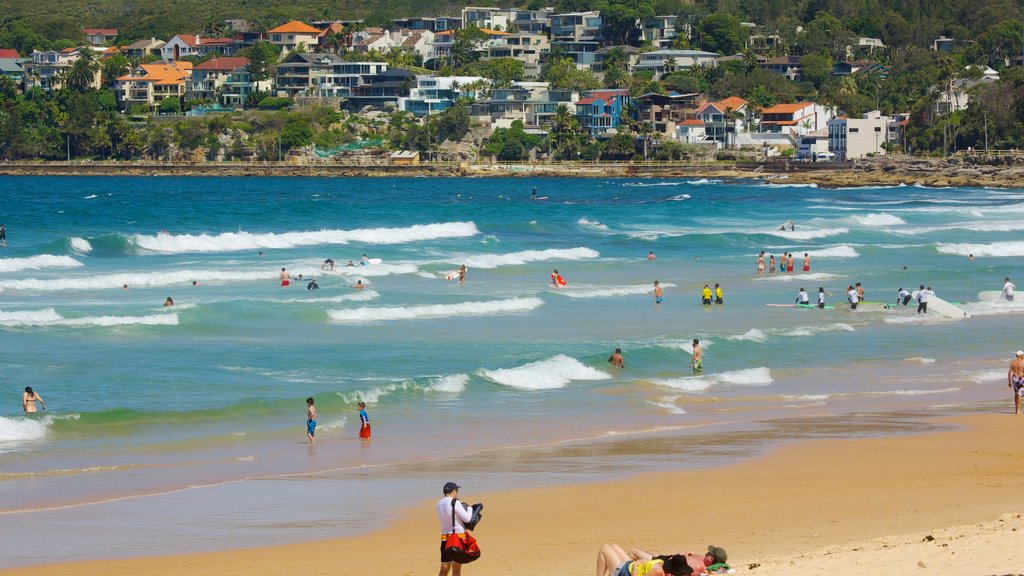 Manly Beach which includes swimming, a sandy beach and a coastal town