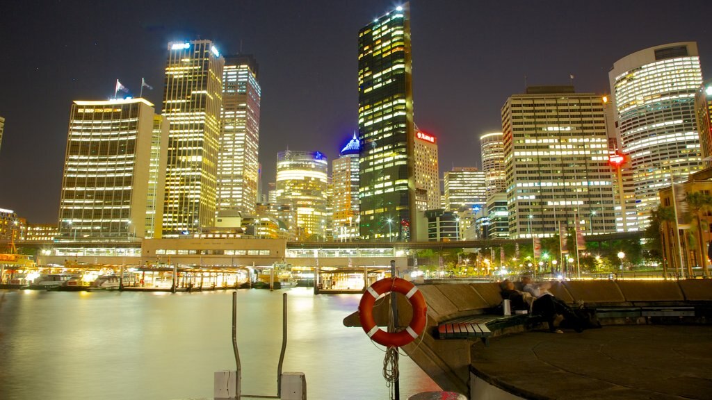 The Rocks which includes night scenes, a river or creek and a city