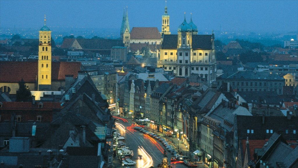 Augsburg which includes night scenes, heritage architecture and a high-rise building