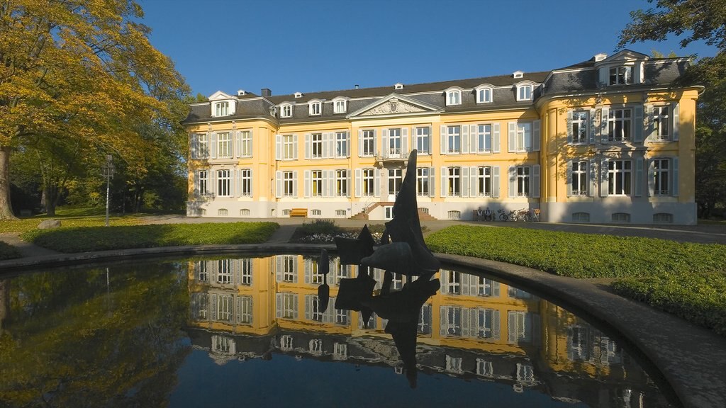 Leverkusen which includes heritage architecture and a pond