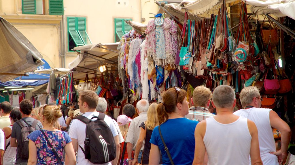 San Lorenzo Church featuring markets and street scenes as well as a large group of people