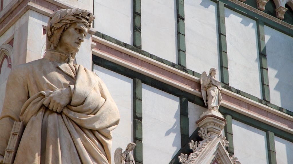 Basilica of Santa Croce showing religious elements, a statue or sculpture and heritage architecture