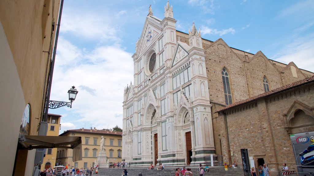 Basilica of Santa Croce showing a square or plaza, a city and heritage architecture