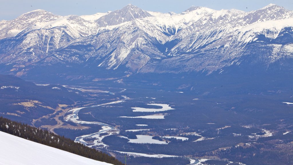 Marmot Basin featuring snow, a river or creek and mountains