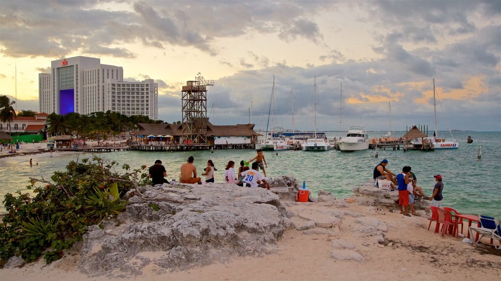 México mostrando paisagens litorâneas, um pôr do sol e uma praia de areia