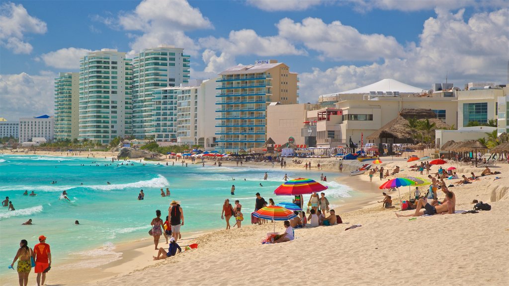 Chac Mool Beach which includes a coastal town, a sandy beach and general coastal views