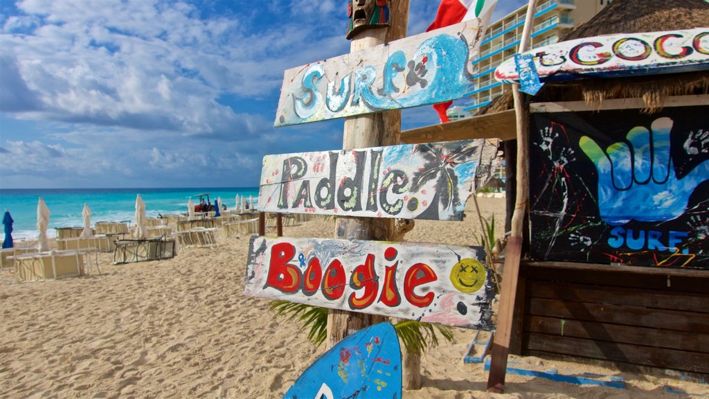 Chac Mool Beach which includes general coastal views, signage and a sandy beach