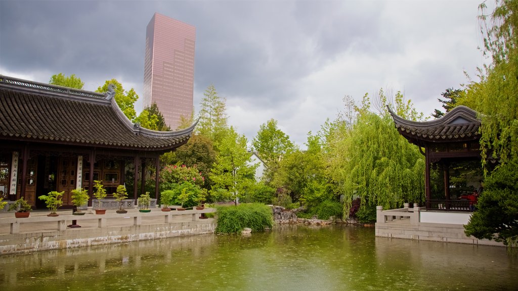 Lan Su Chinese Garden which includes a park, heritage elements and a pond