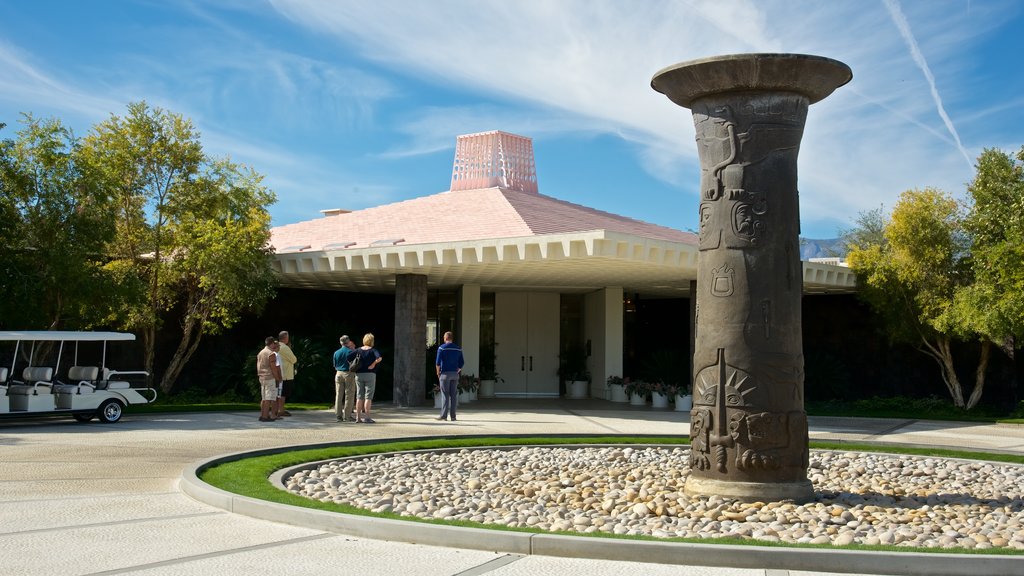 Sunnylands Center and Gardens featuring outdoor art and a house as well as a small group of people