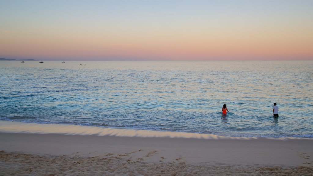 Palmilla Beach which includes a sandy beach, swimming and a sunset