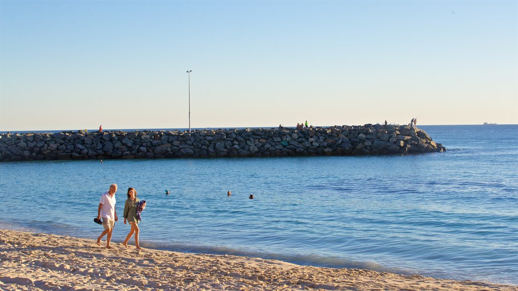 Cottesloe Beach showing a beach and general coastal views as well as a couple