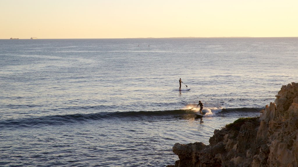 Cottesloe Beach showing surfing, waves and general coastal views