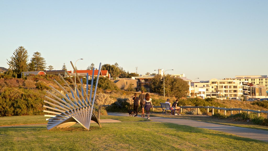 Cottesloe Beach showing a coastal town, a park and outdoor art