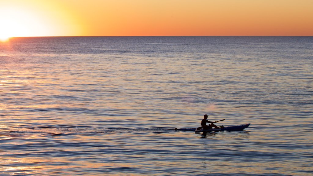 Cottesloe Beach featuring kayaking or canoeing, a sunset and general coastal views