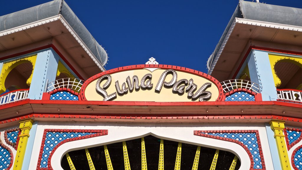 Luna Park featuring rides and signage