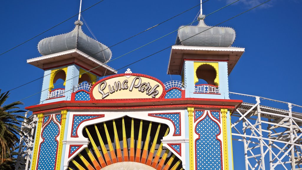 Luna Park featuring signage and rides