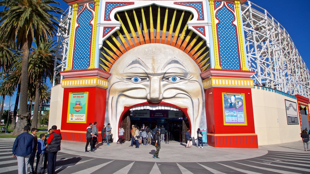 Luna Park featuring rides, signage and outdoor art