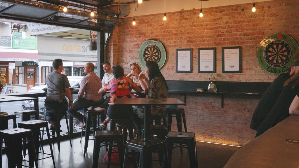 The Catchment Brewing Co. featuring a bar and interior views as well as a small group of people