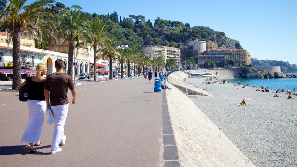 Promenade des Anglais menampilkan pantai berpasir, alam tropis dan kota pesisir