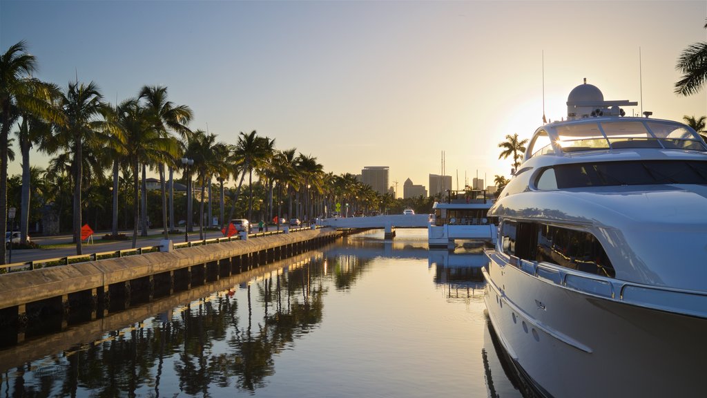 Las Olas Boulevard showing a sunset and a bay or harbour