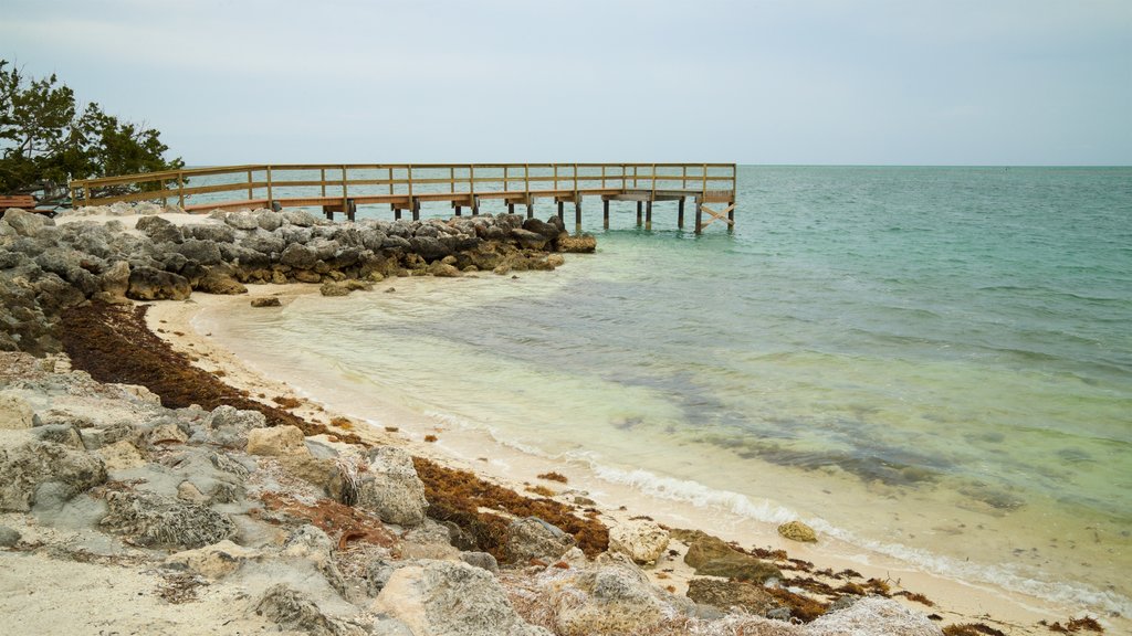 Sunset Park Beach which includes rugged coastline, a sandy beach and general coastal views