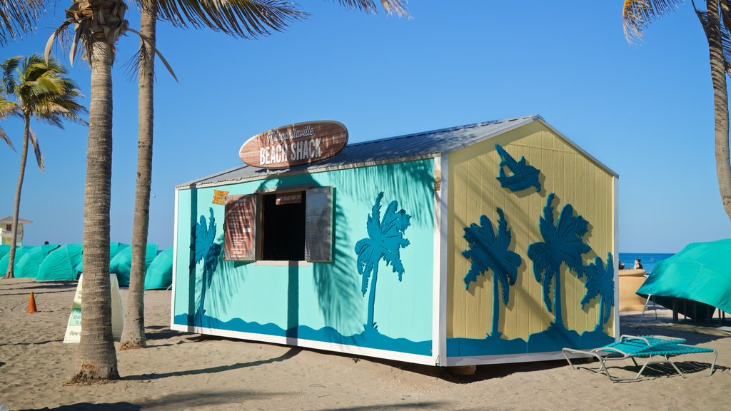 Hollywood Beach showing a beach bar, a beach and signage