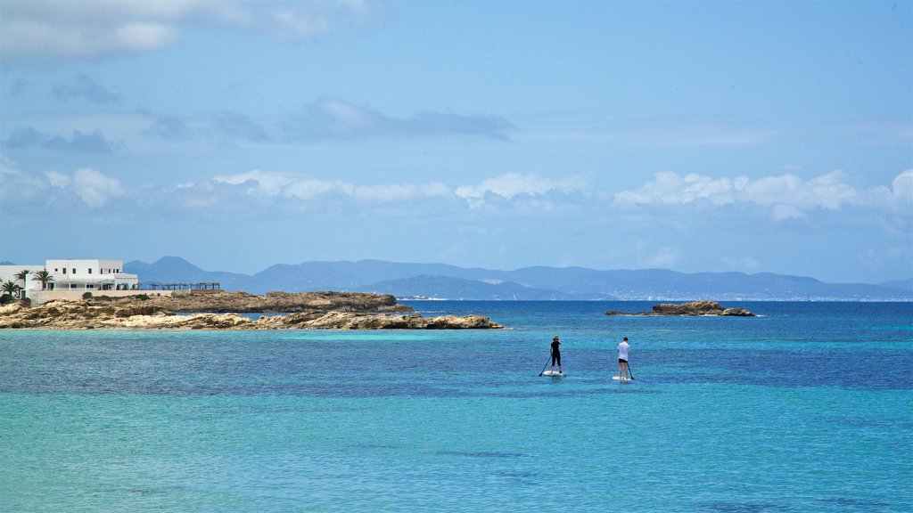 Es Pujols Beach showing kayaking or canoeing, rugged coastline and general coastal views