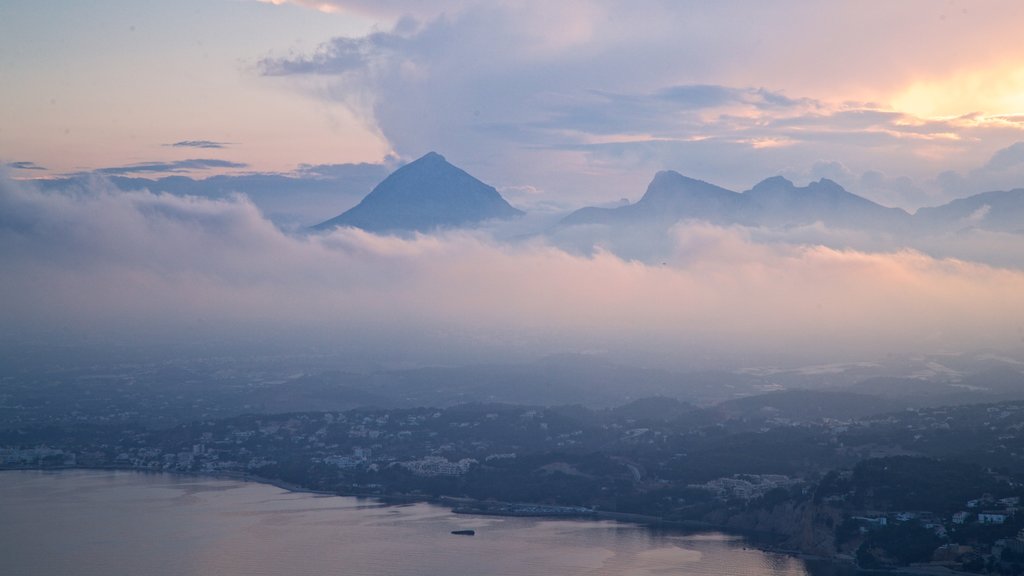 Mirador Monte Toix showing landscape views, a coastal town and mist or fog